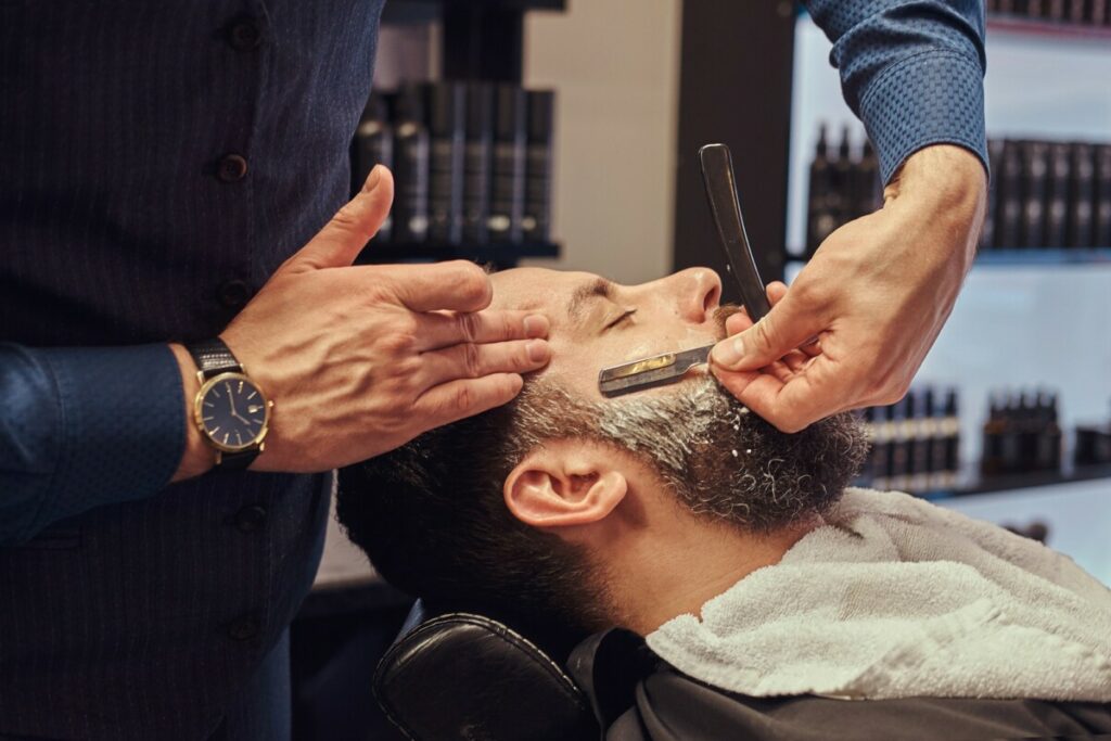 Master hairdresser and client in a hairdressing salon.